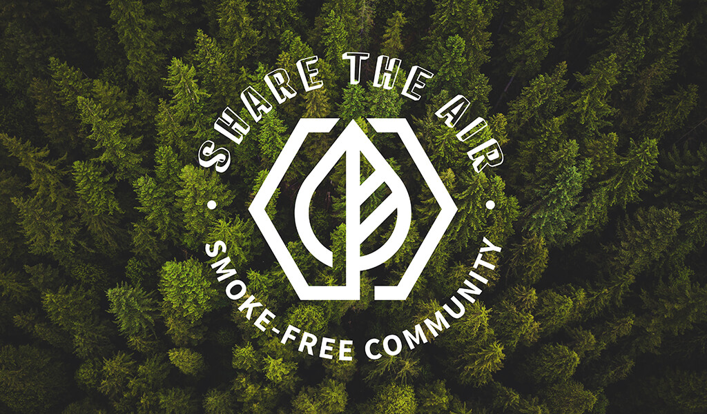 Share the Air logo over a forest of tall trees