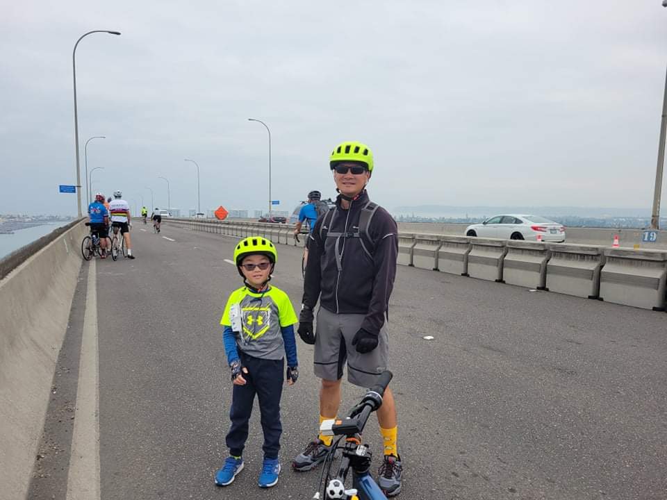 Peter and his son bike the Coronado Bay bridge